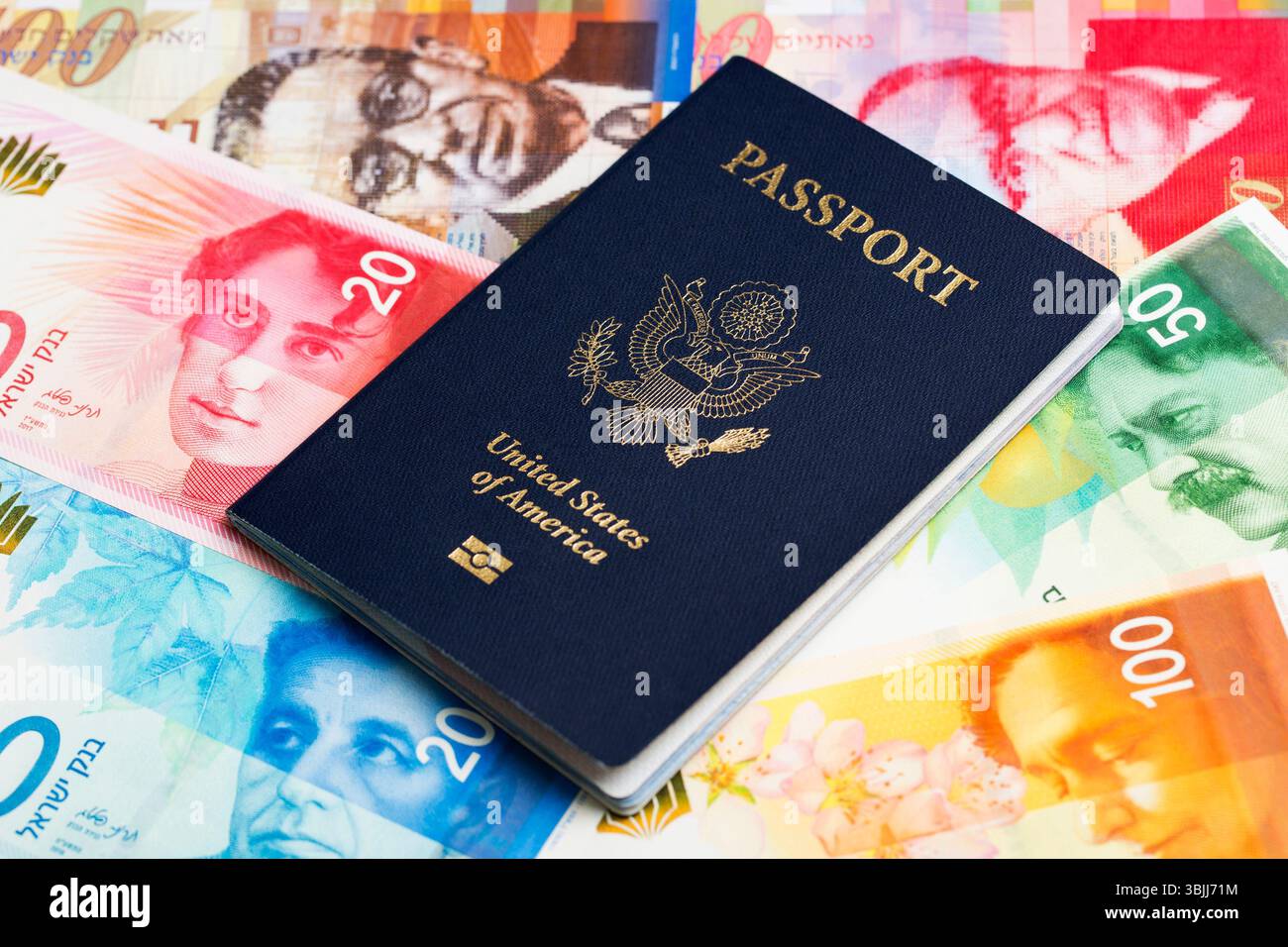 American passport on Israeli money - Shekel Stock Photo