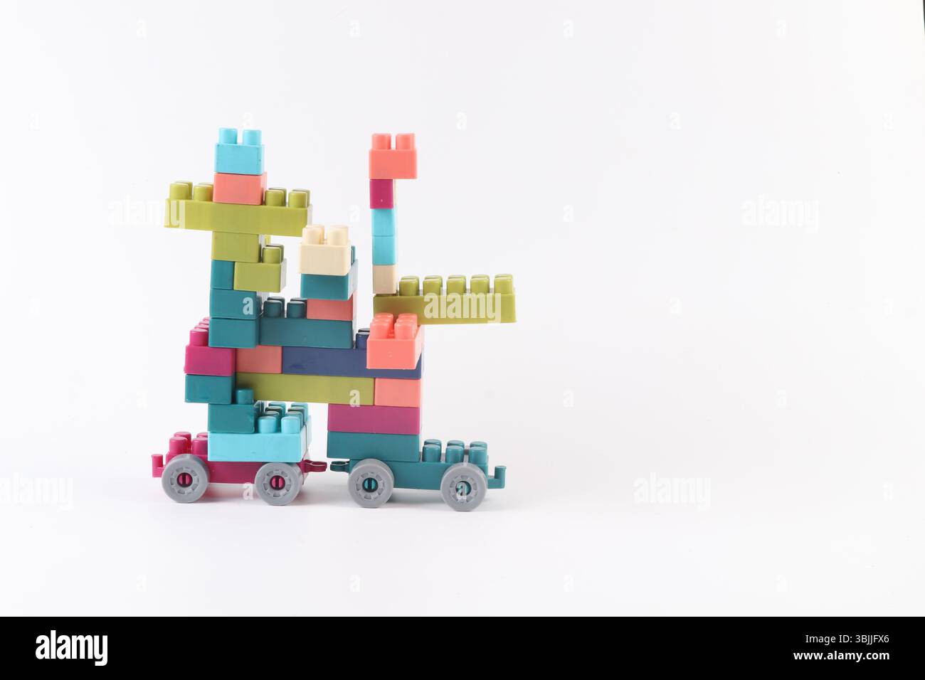 Plastic building blocks form vehicle on white background Stock Photo