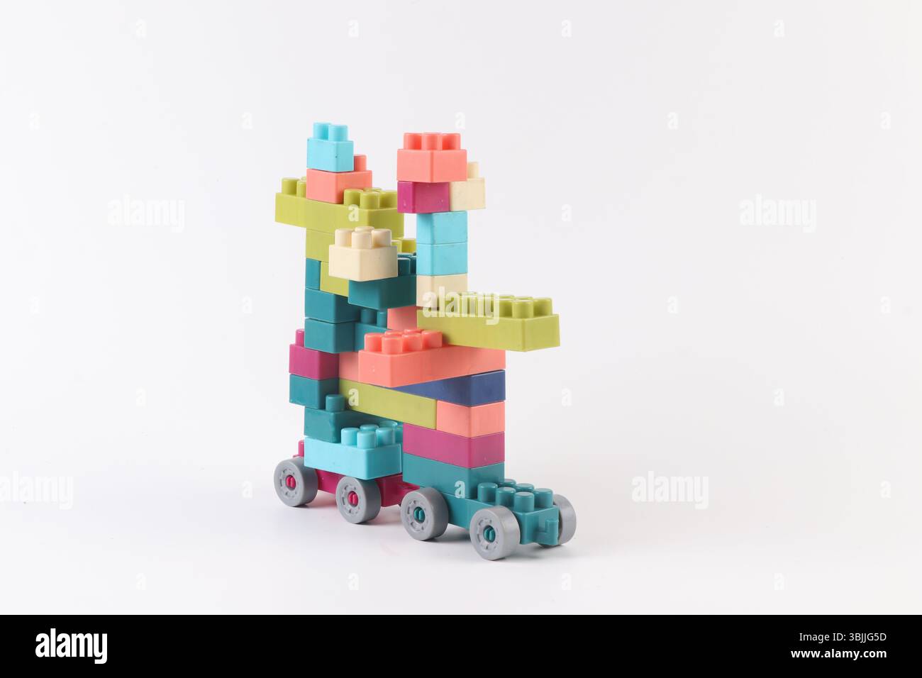Plastic building blocks form vehicle on white background Stock Photo