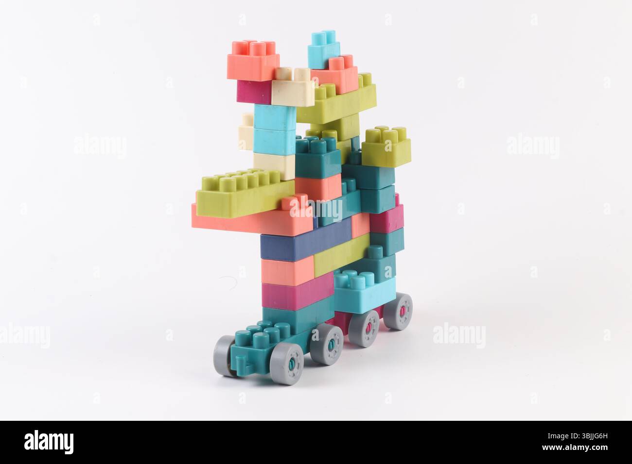 Plastic building blocks form vehicle on white background Stock Photo
