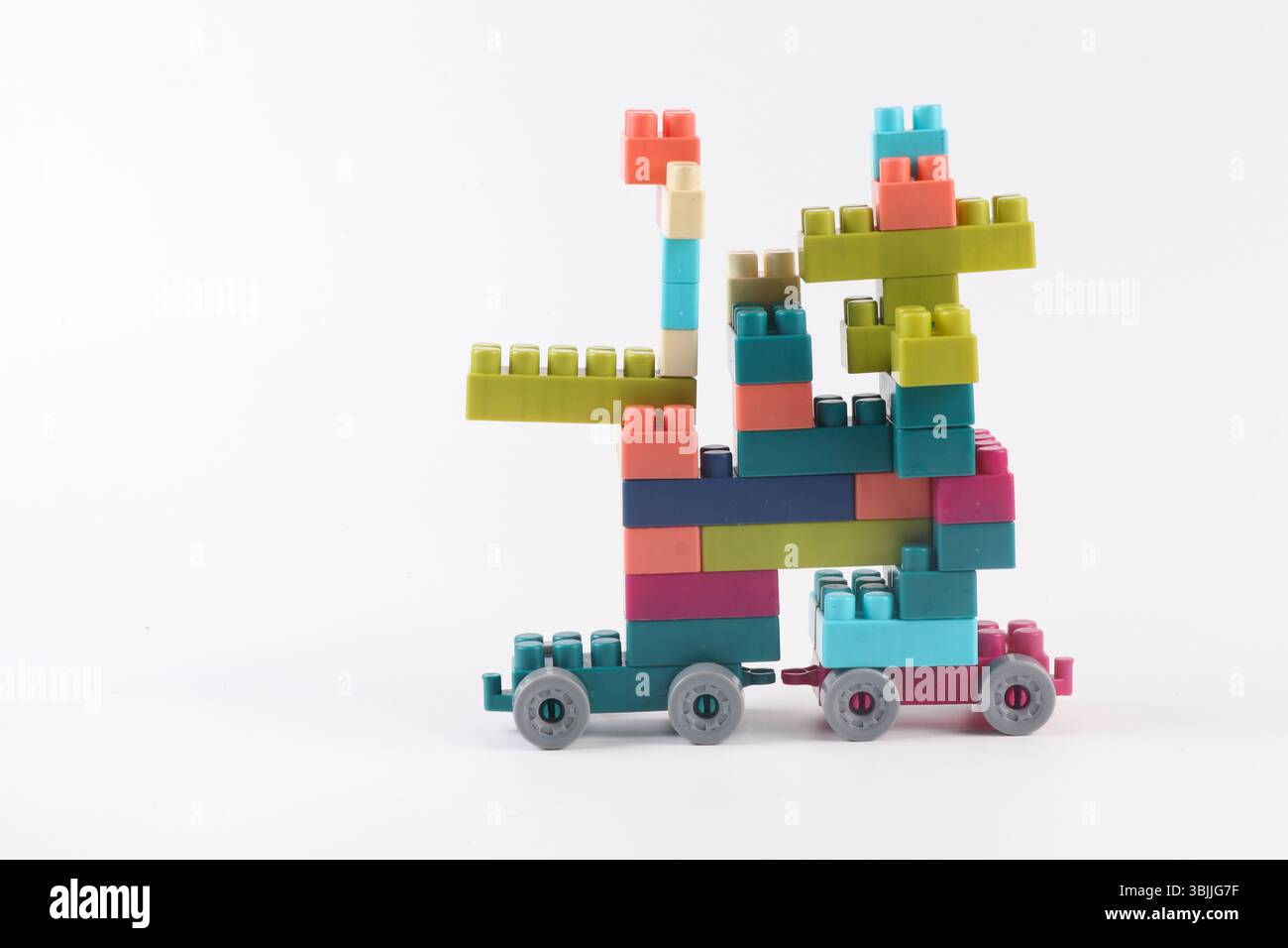 Plastic building blocks form vehicle on white background Stock Photo