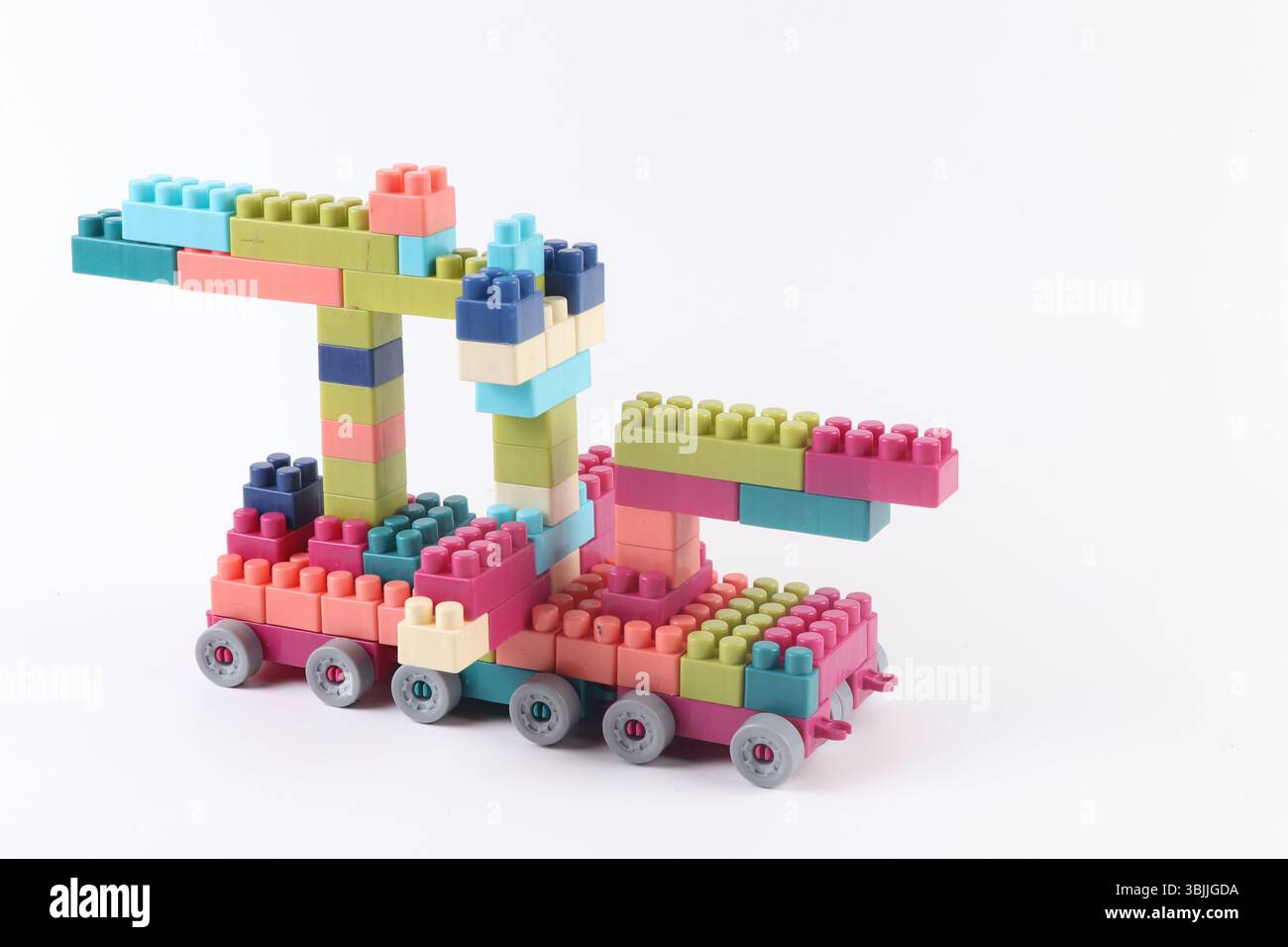 Plastic building blocks form vehicle on white background Stock Photo