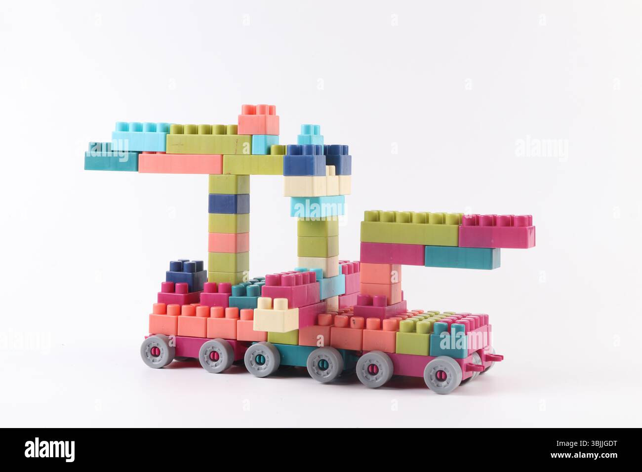 Plastic building blocks form vehicle on white background Stock Photo