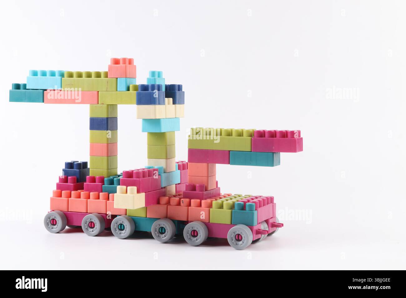 Plastic building blocks form vehicle on white background Stock Photo