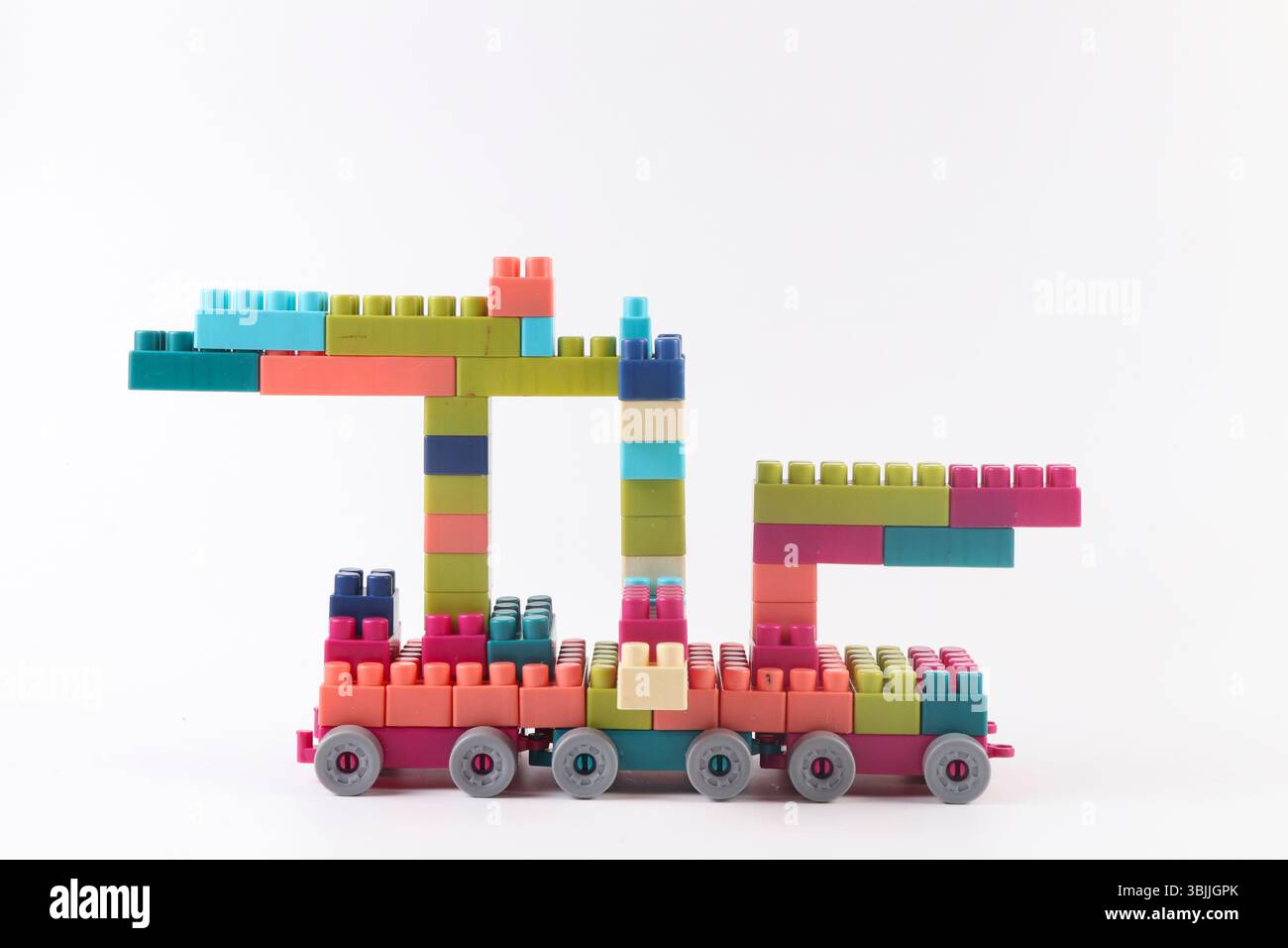 Plastic building blocks form vehicle on white background Stock Photo