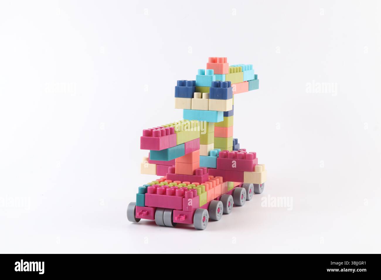 Plastic building blocks form vehicle on white background Stock Photo
