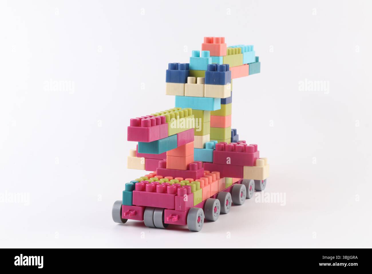 Plastic building blocks form vehicle on white background Stock Photo