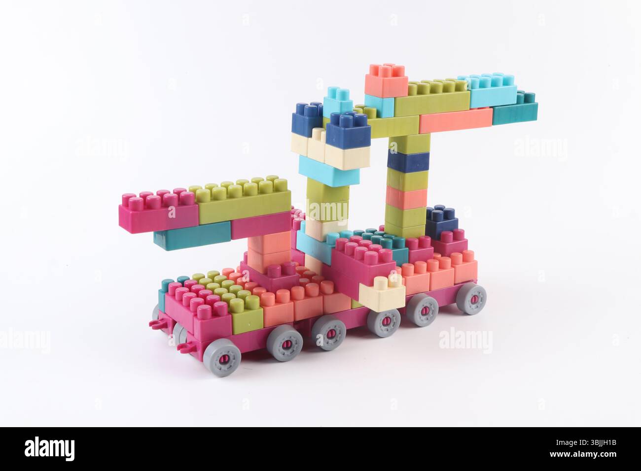 Plastic building blocks form vehicle on white background Stock Photo
