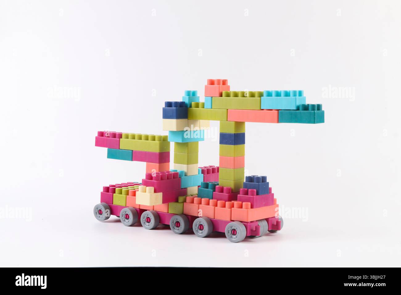 Plastic building blocks form vehicle on white background Stock Photo