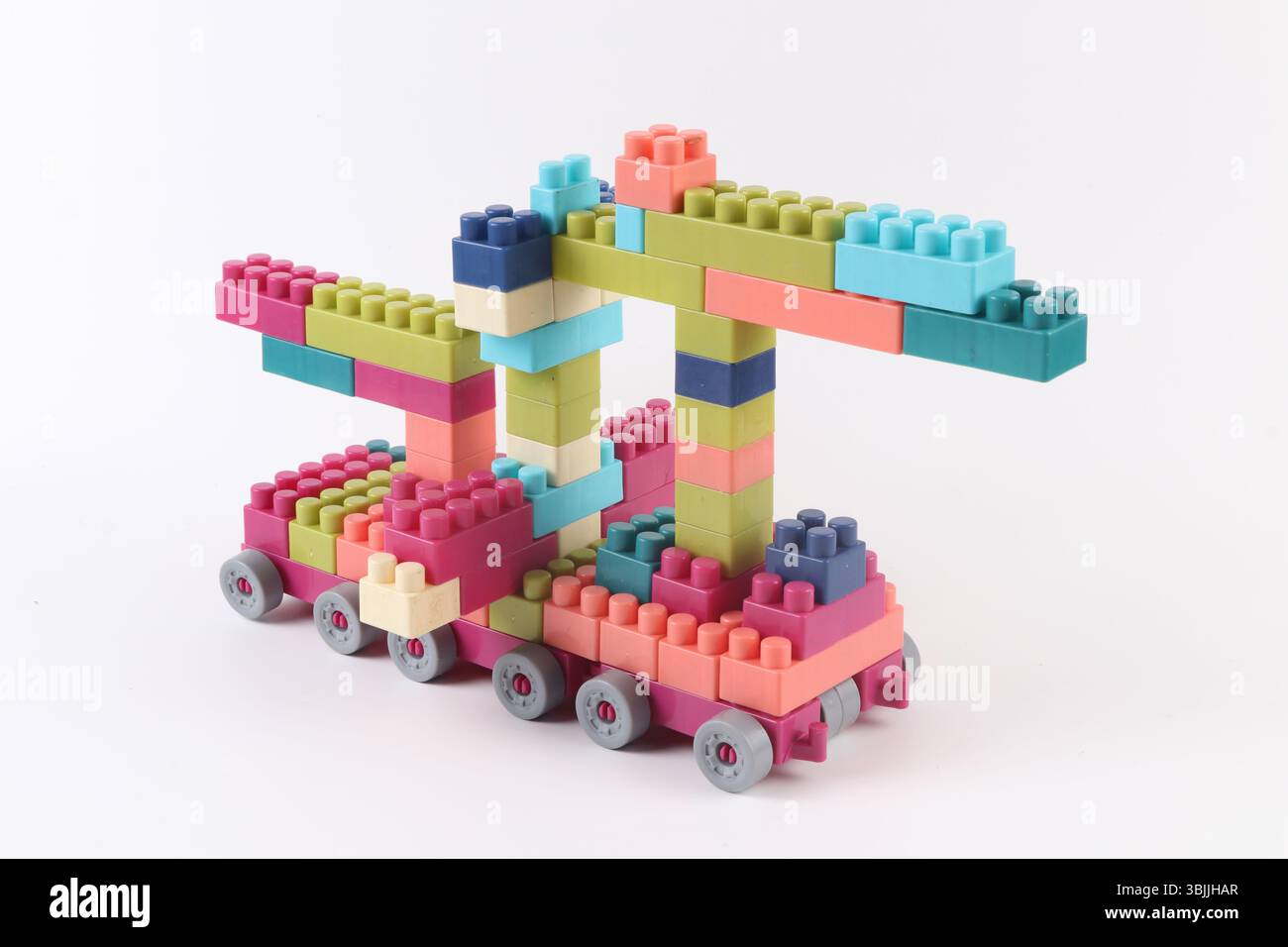 Plastic building blocks form vehicle on white background Stock Photo