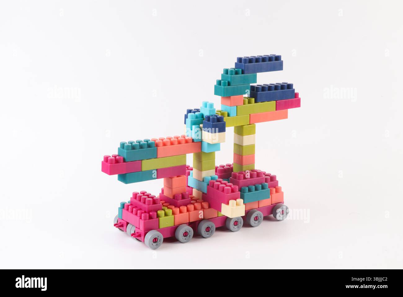 Plastic building blocks form vehicle on white background Stock Photo