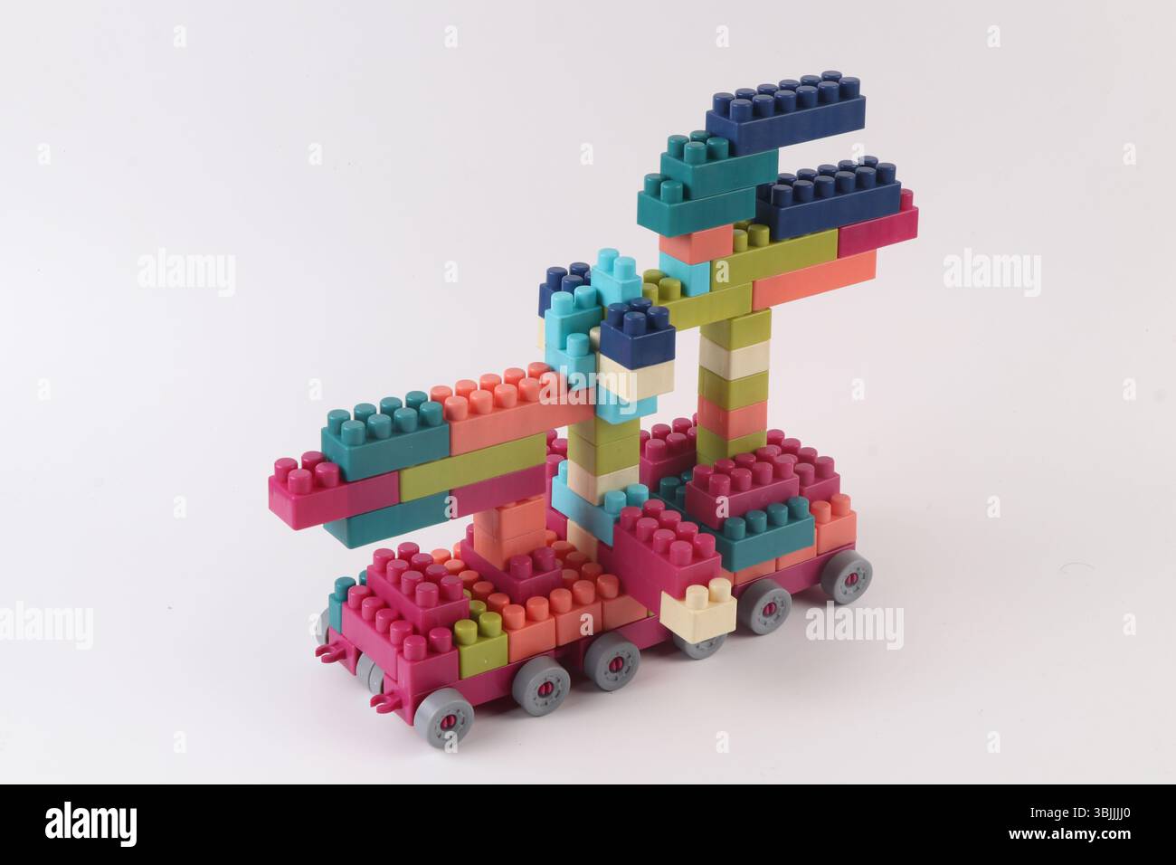 Plastic building blocks form vehicle on white background Stock Photo