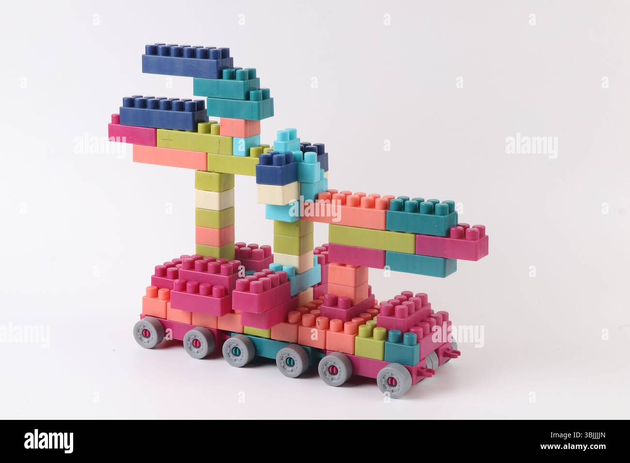 Plastic building blocks form vehicle on white background Stock Photo