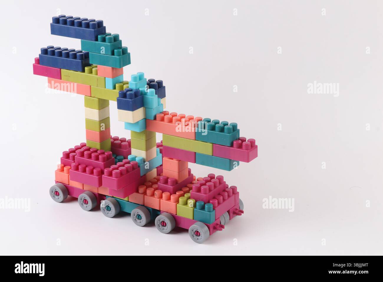 Plastic building blocks form vehicle on white background Stock Photo