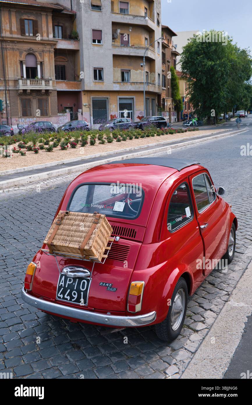 A Fiat 500 car with a picnic hamper on the boot rack Stock Photo