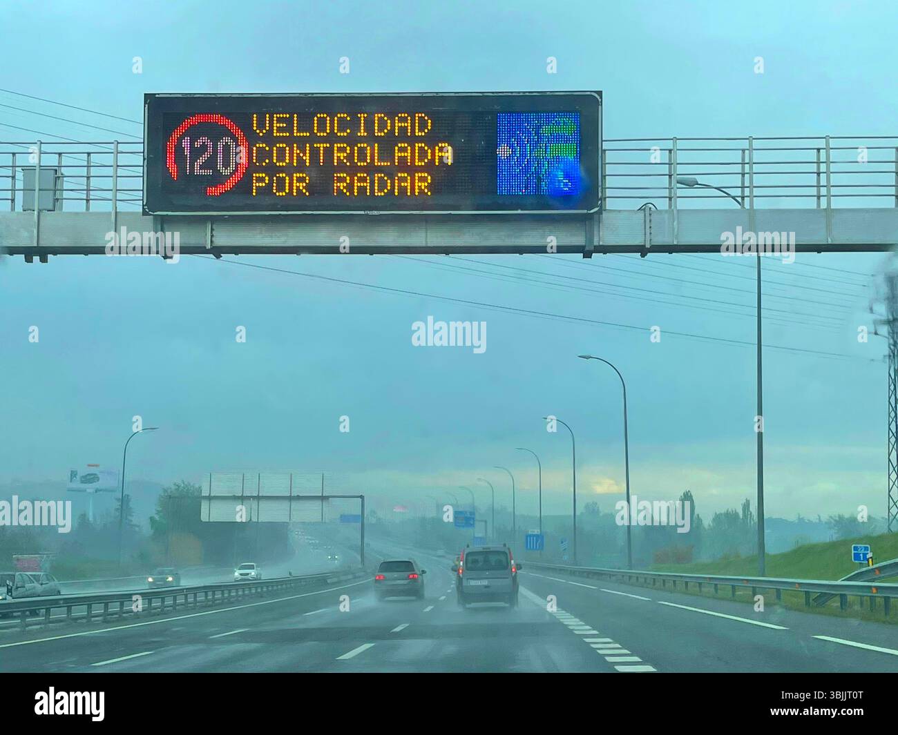 Driving in a rainy day. A-1 motorway, Madrid, Spain. - Smartphone Captured Stock Image