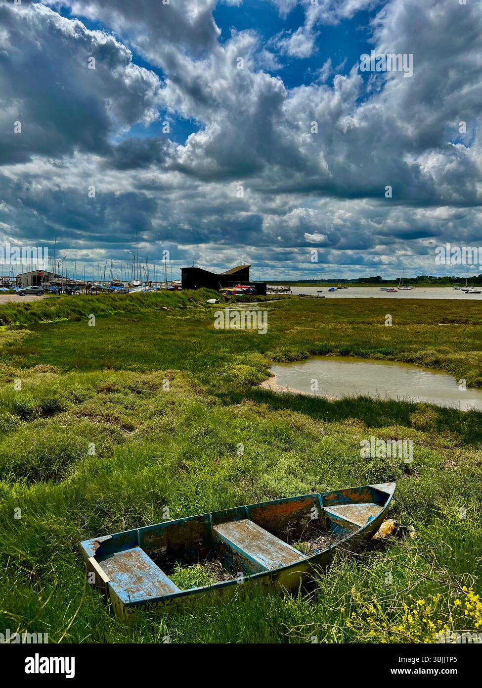 An old boat rotting away at he seaside town of Aldeburgh in Suffolk, eastern England, UK - Smartphone Captured Stock Image