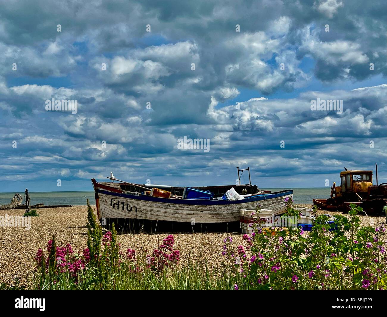 A fishing boat on the shore at The seaside town of Aldeburgh in Suffolk, eastern England, UK - Smartphone Captured Stock Image