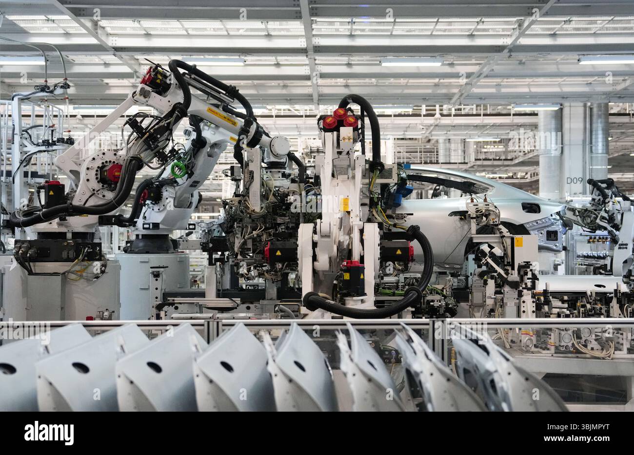 Beijing, China. 16th June, 2025. Robots work at Xiaomi's automobile ...