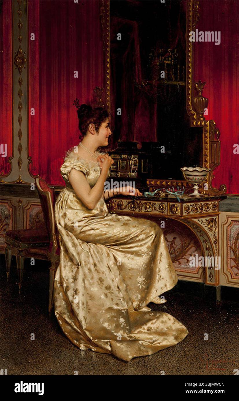 Painting by Vittorio Reggianini (1858–1938) depicting a girl looking into a mirror. The work reflects 19th-century genre painting with interior detail and refined costume. Stock Photo