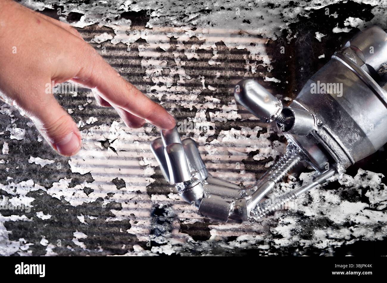 Connection between human and robot against rusty background Stock Photo