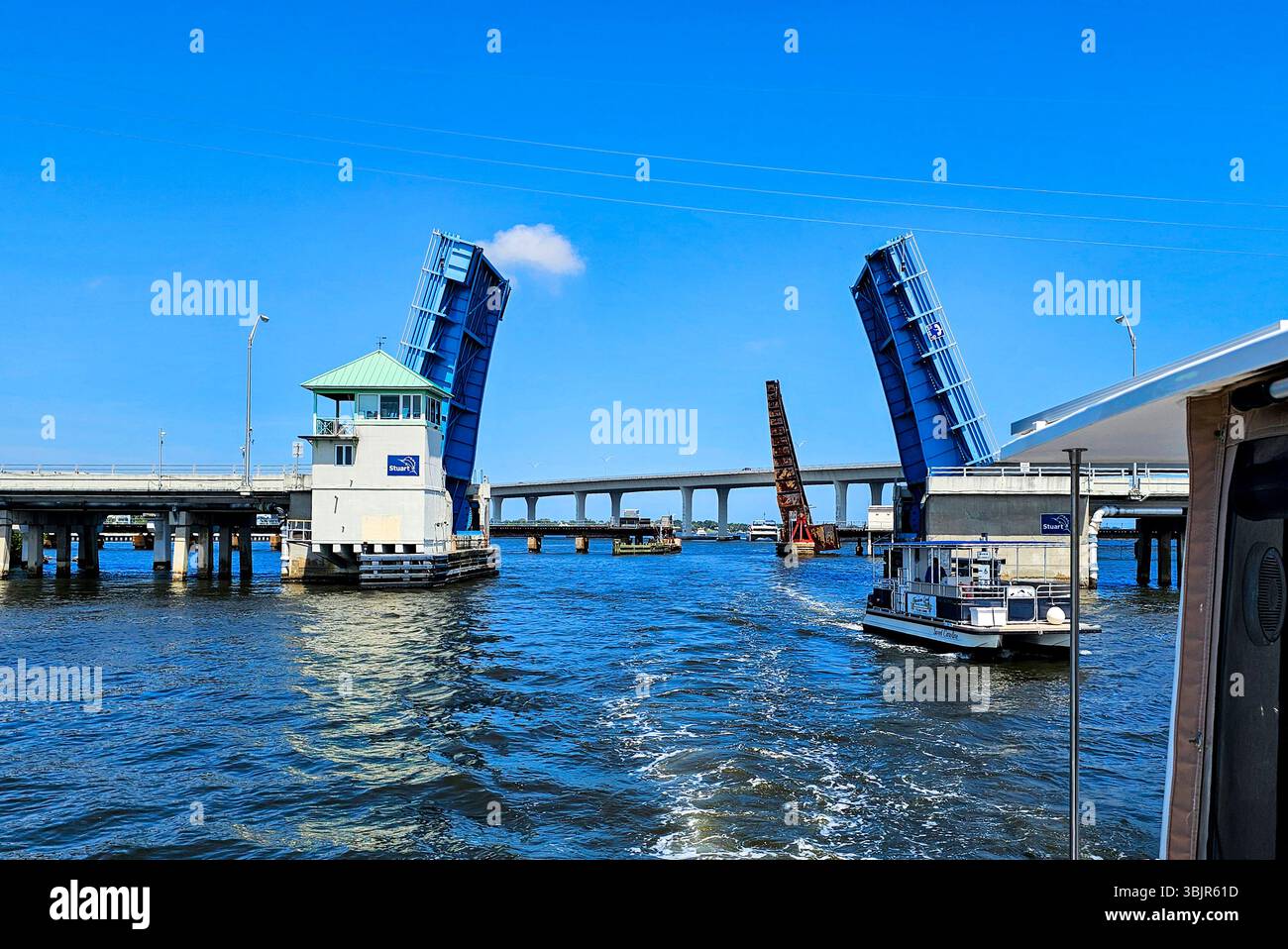Old Roosevelt Bridge and railway bridge opening for boats in Stuart, Florida - Smartphone Captured Stock Image