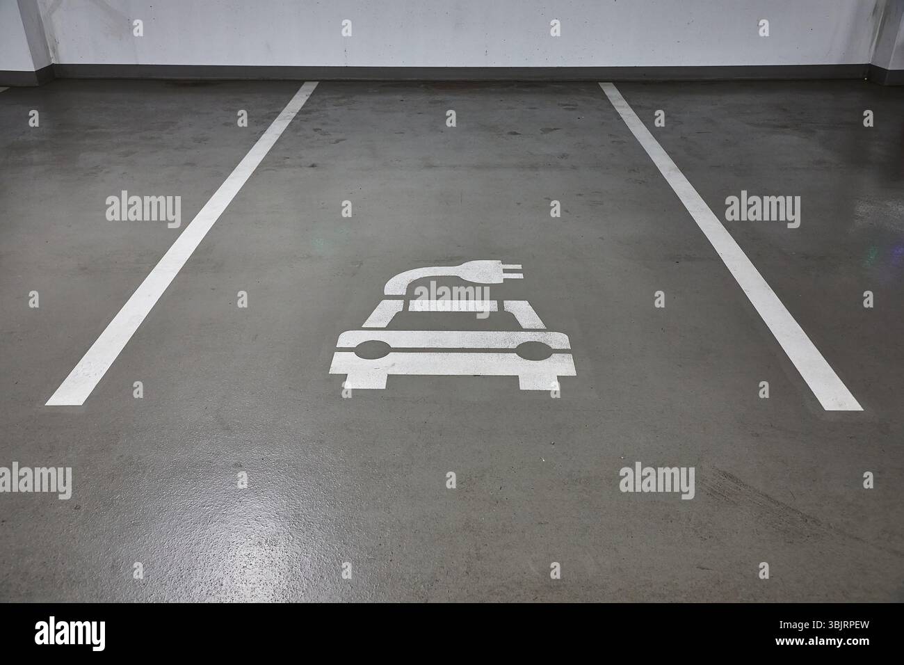 Electric car charging station in a carpark Stock Photo