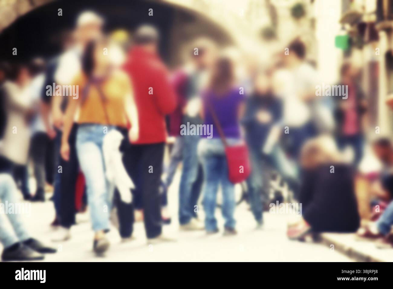 Strong blur, anonymous people on streets of Europe. Crowds of tourists in old city Stock Photo