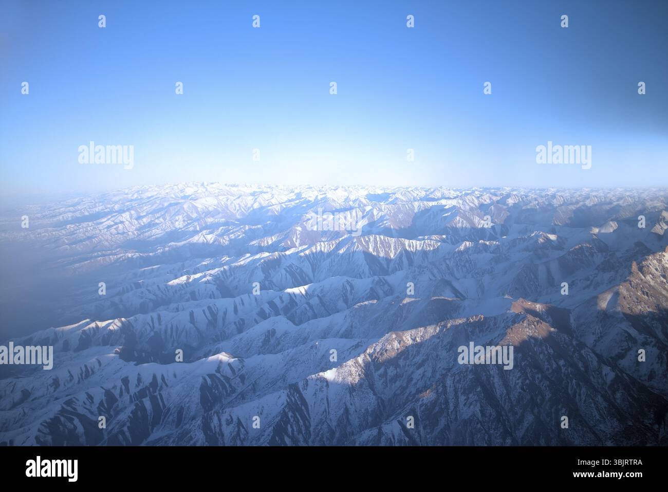 Parallel Mountain Ridges Flight over Pamir and Tien Shan 1. Air travel. Visible deep mountain ...