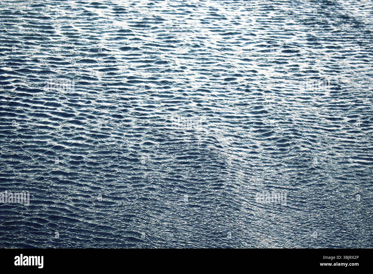 Small beautiful ripples on sea surface . Light day cool breeze Stock Photo