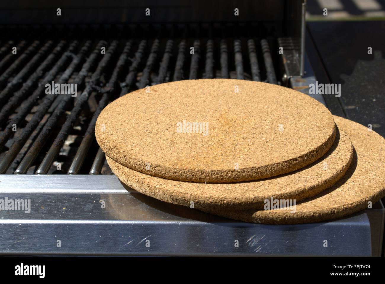 pile of cork trivets on grill Stock Photo - Alamy