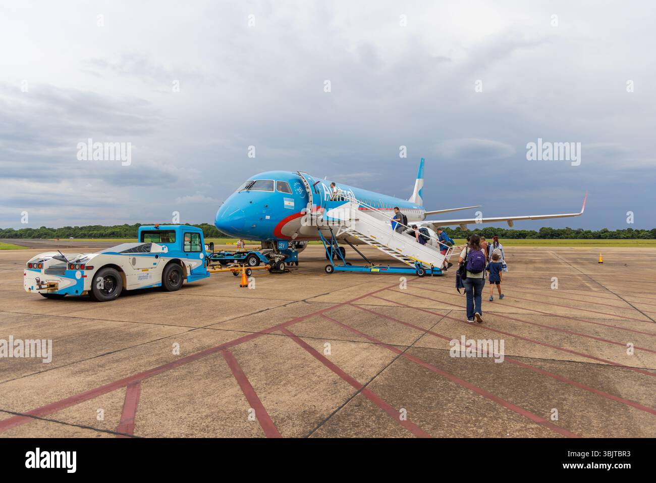 Puerto Iguazu, Misiones, Argentina - May 26th, 2025: Tourists boarding a plane at Puerto Iguazu International Airport in Misiones. Stock Photo