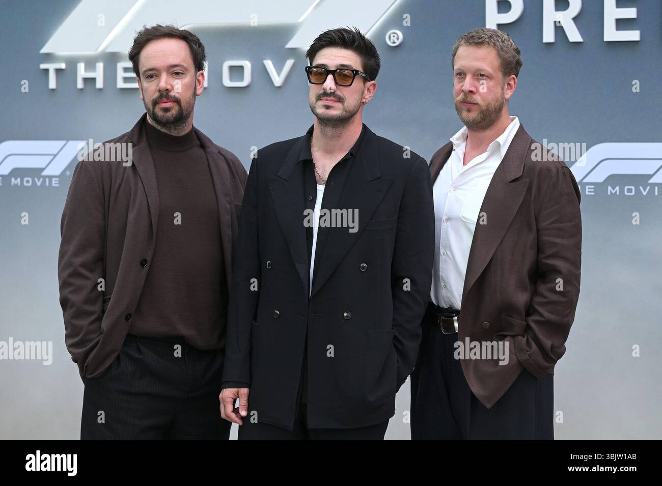 Marcus Mumford, Ben Lovett and Ted Dwane of Mumford & Sons walking on