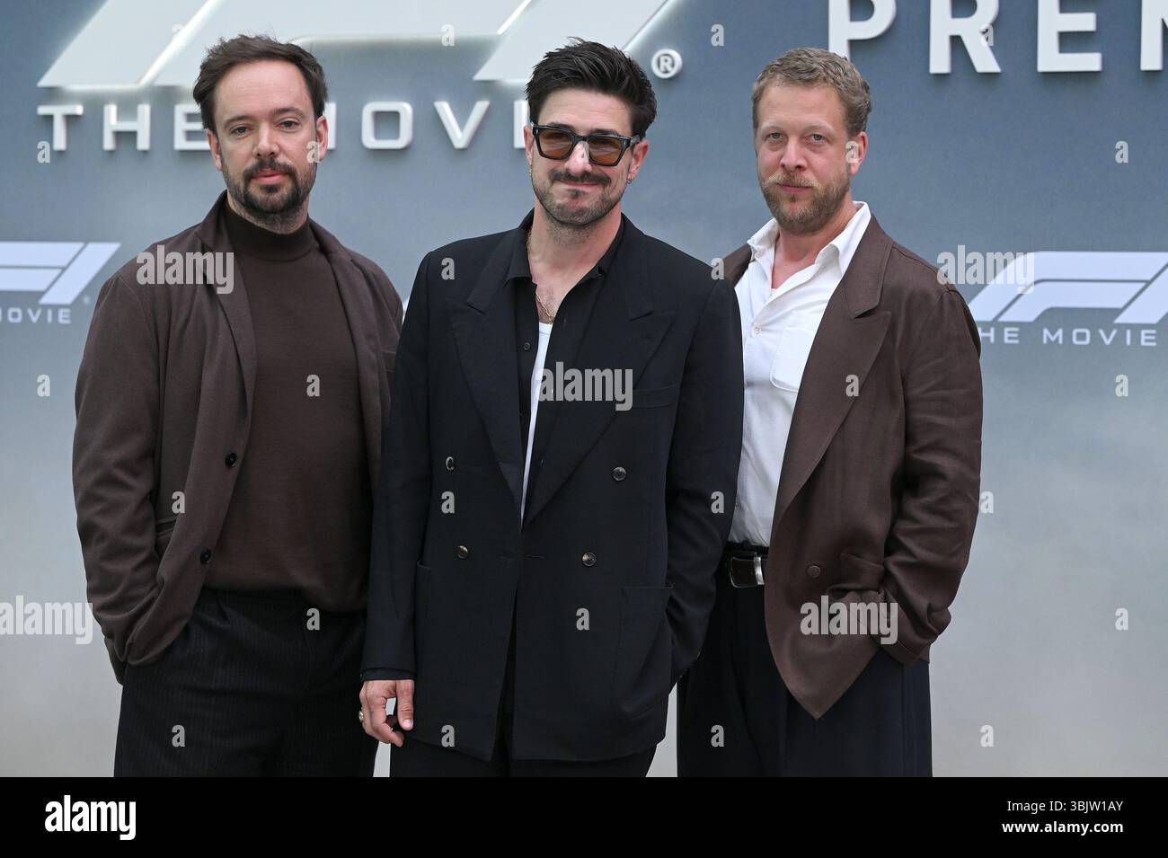 Marcus Mumford, Ben Lovett and Ted Dwane of Mumford & Sons walking on