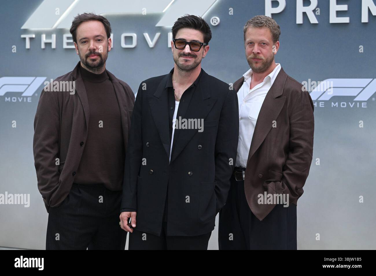 Marcus Mumford, Ben Lovett and Ted Dwane of Mumford & Sons walking on