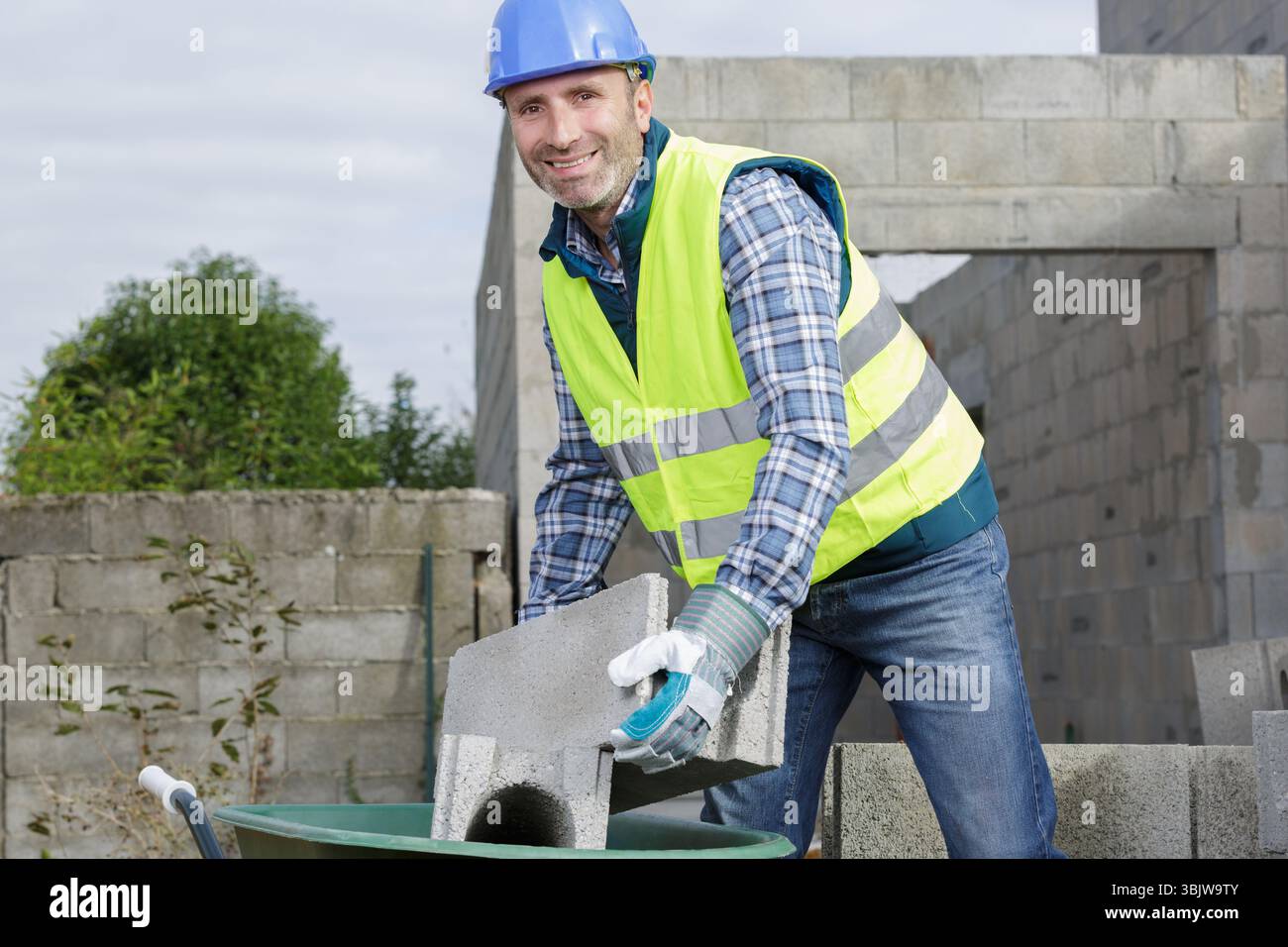 Using wheelbarrow in construction hi-res stock photography and images ...