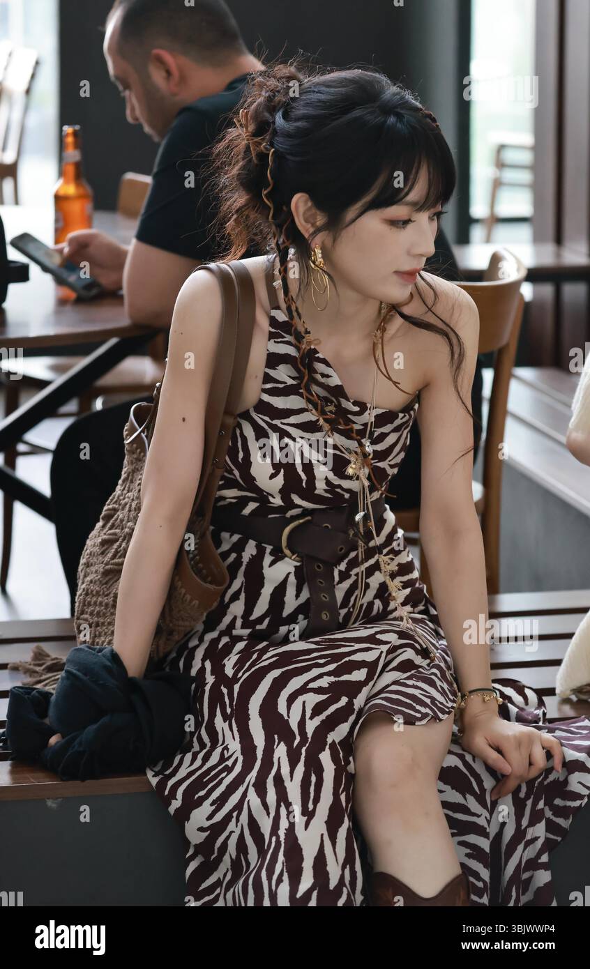 Chinese actress Tian Xiwei appears at the airport in Shanghai, China ...