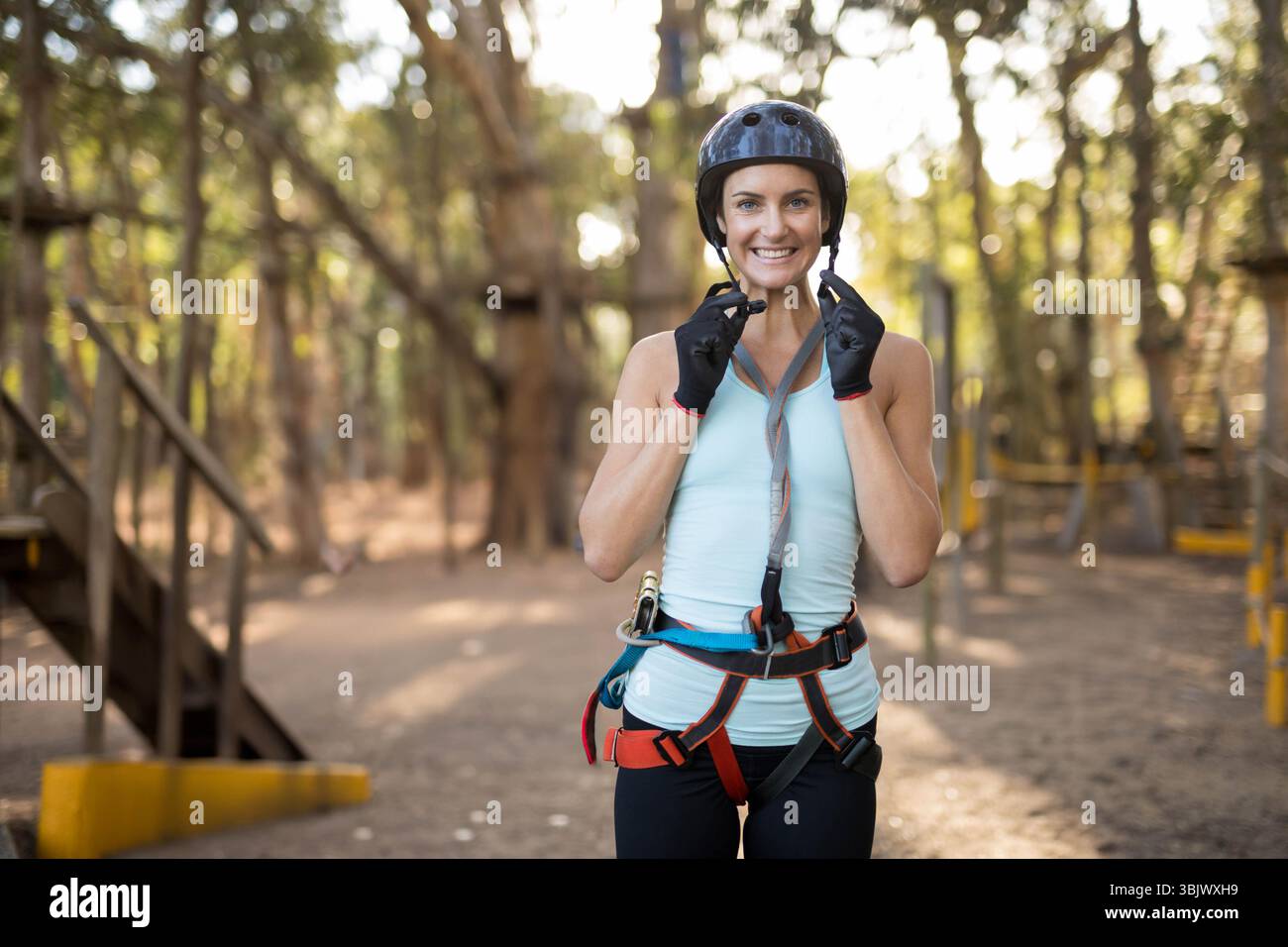 Woman adjusting red harness on hi-res stock photography and images - Alamy