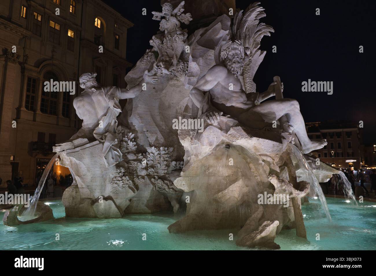 Fontana dei Quattro Fiumi at night in Piazza Navona, Rome, Italy Stock Photo