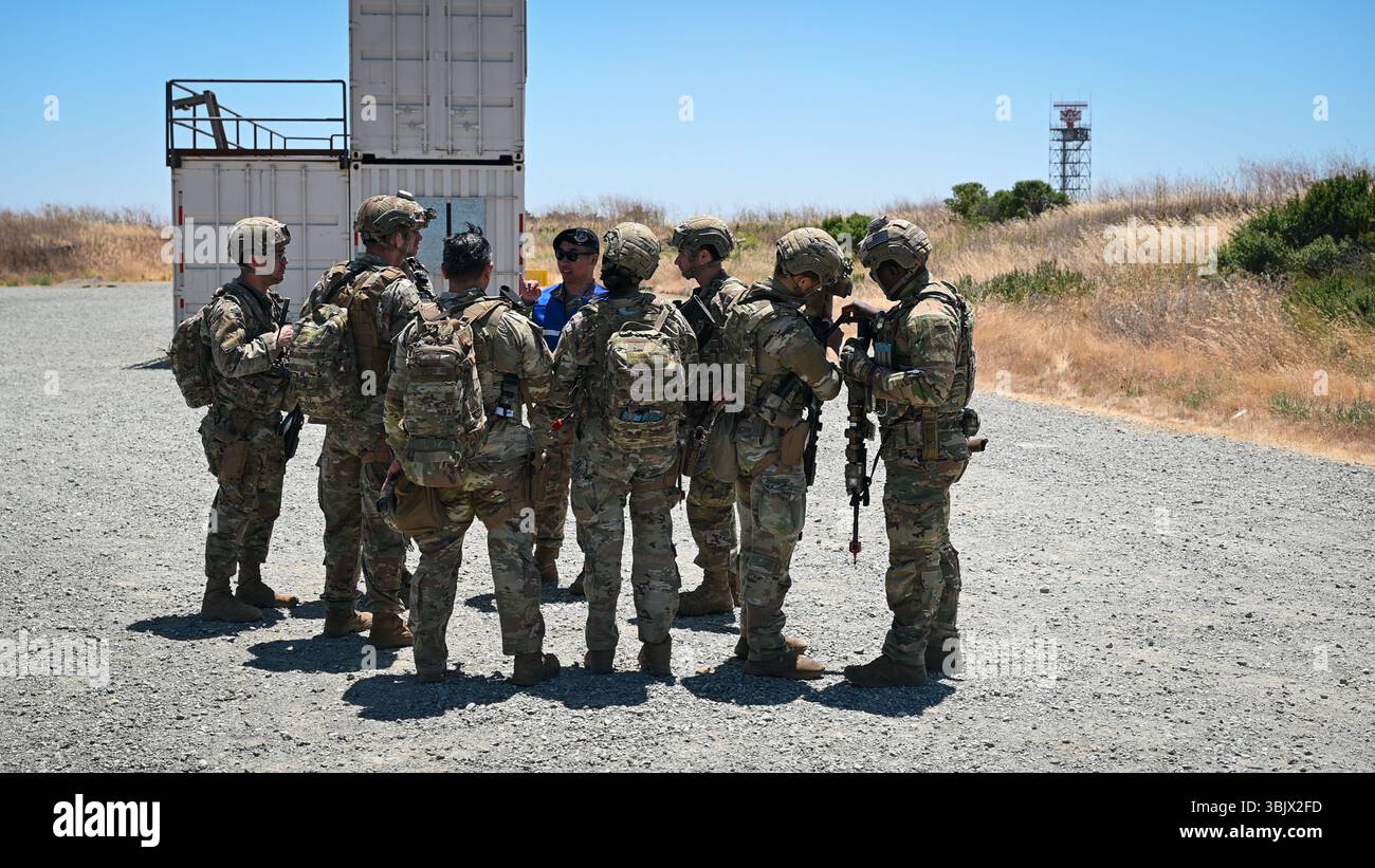 A Wing Inspection Team (WIT) inspector briefs a team of Defenders from ...