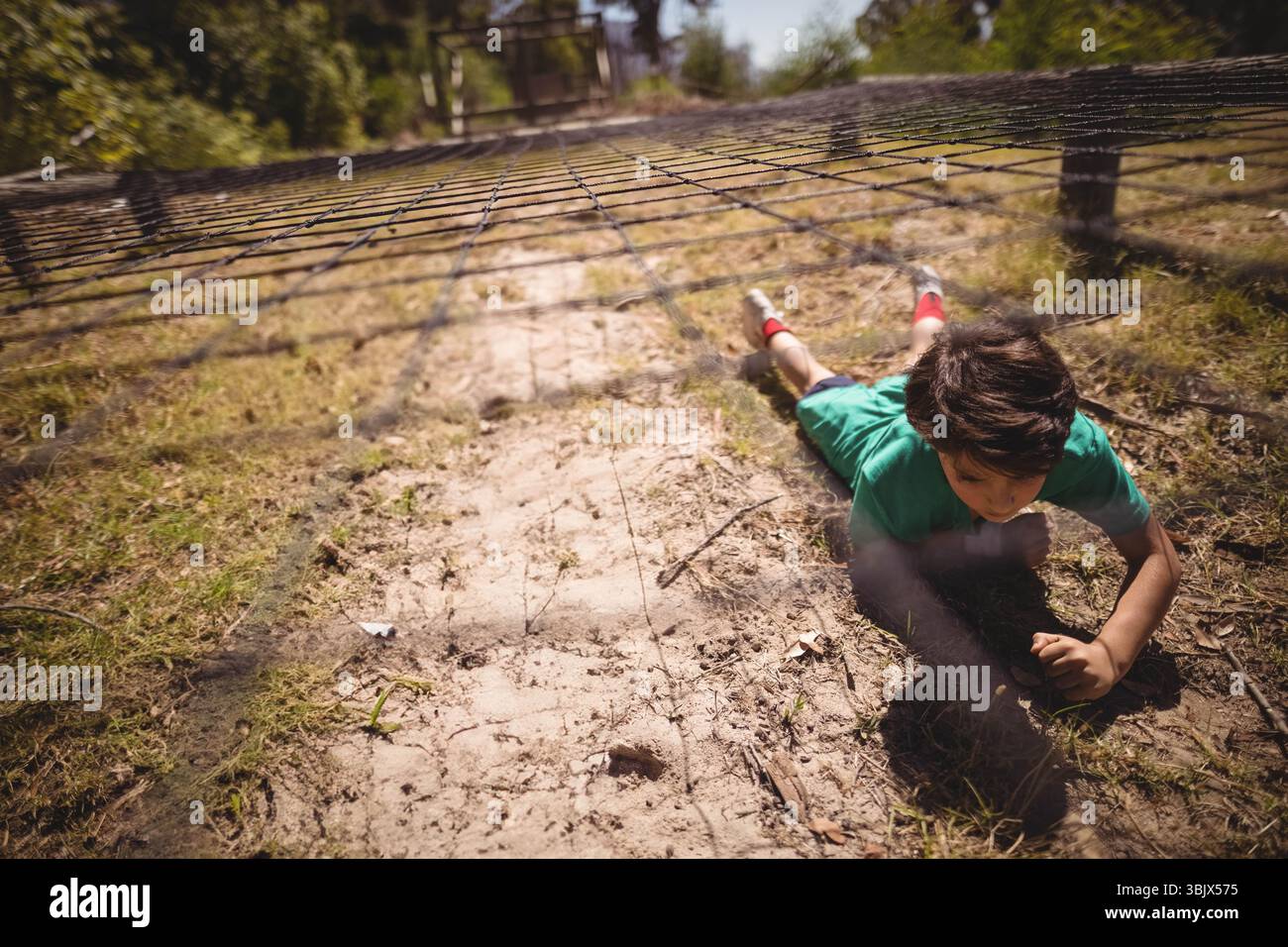 Boy crawling under net hi-res stock photography and images - Alamy