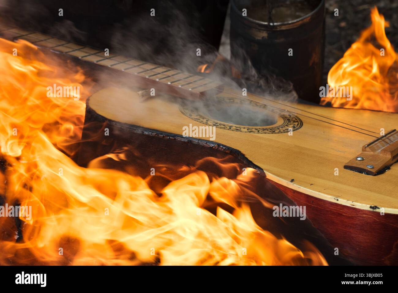 Guitar in flame on bonfire Stock Photo - Alamy
