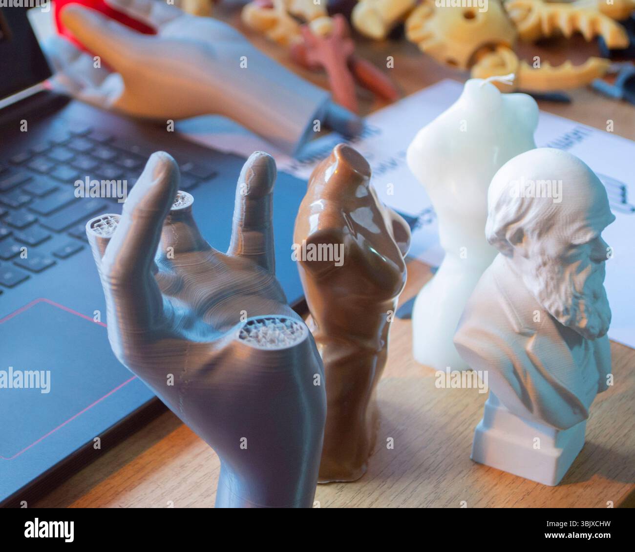 Small different figures made of plastic printed on a 3D printer on the ...
