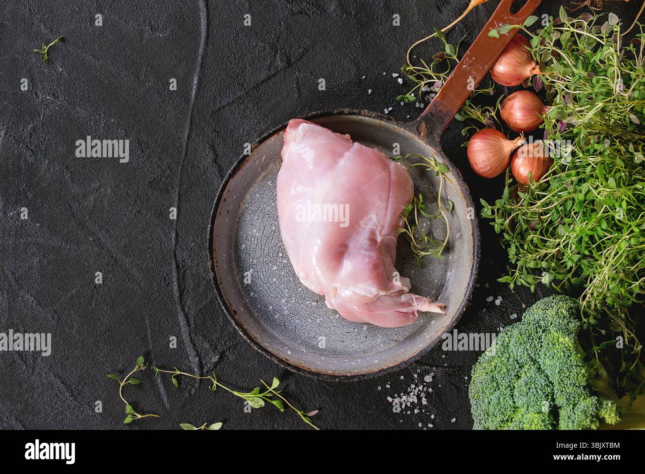 Raw rabbit legs with vegetables Stock Photo