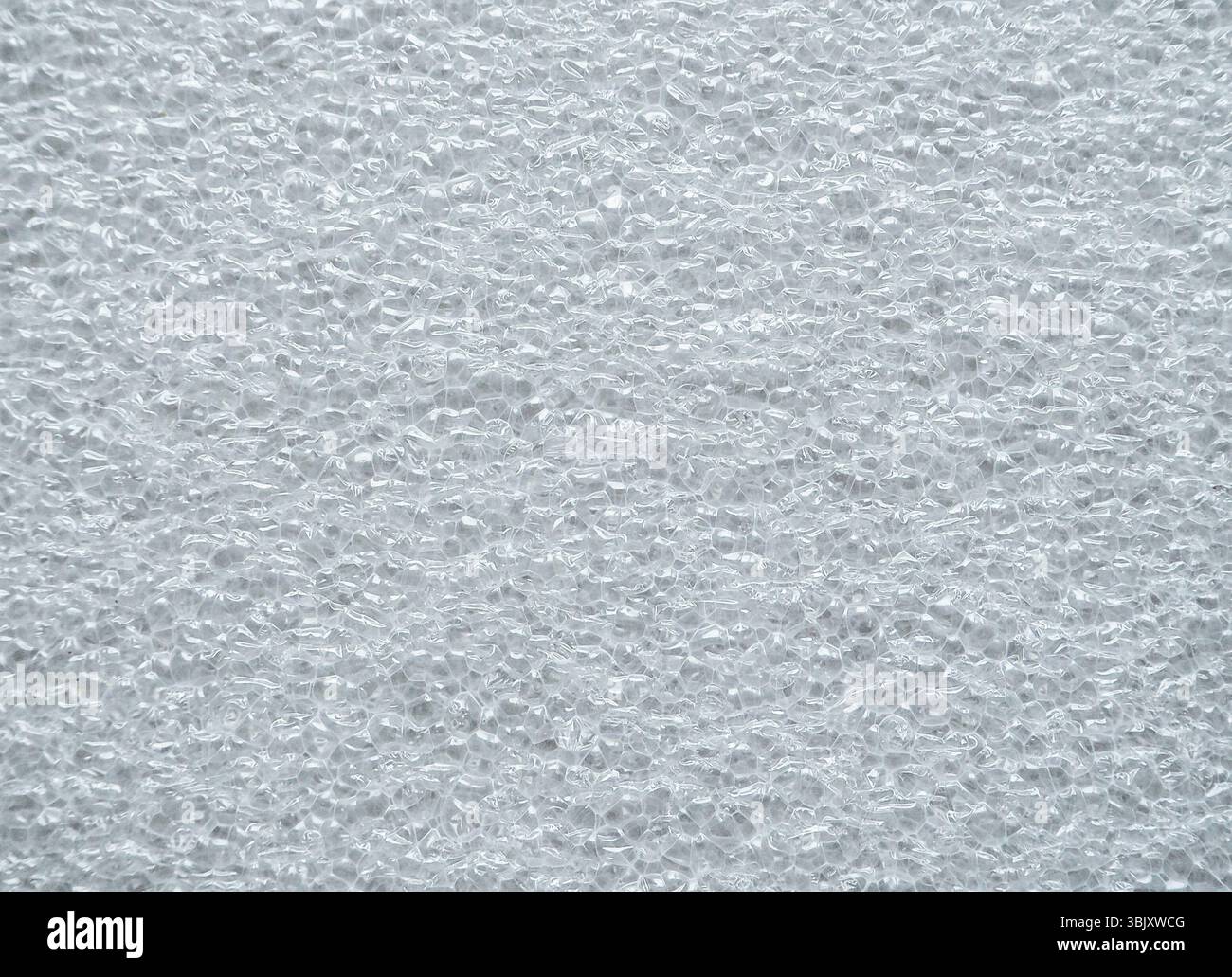 A dimpled white structure. Background of foamed polyethylene. Stock Photo