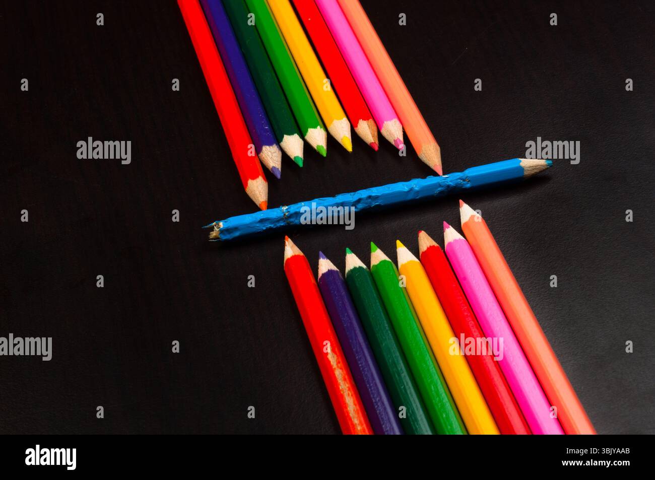 Monster made out of pencils on black board Stock Photo