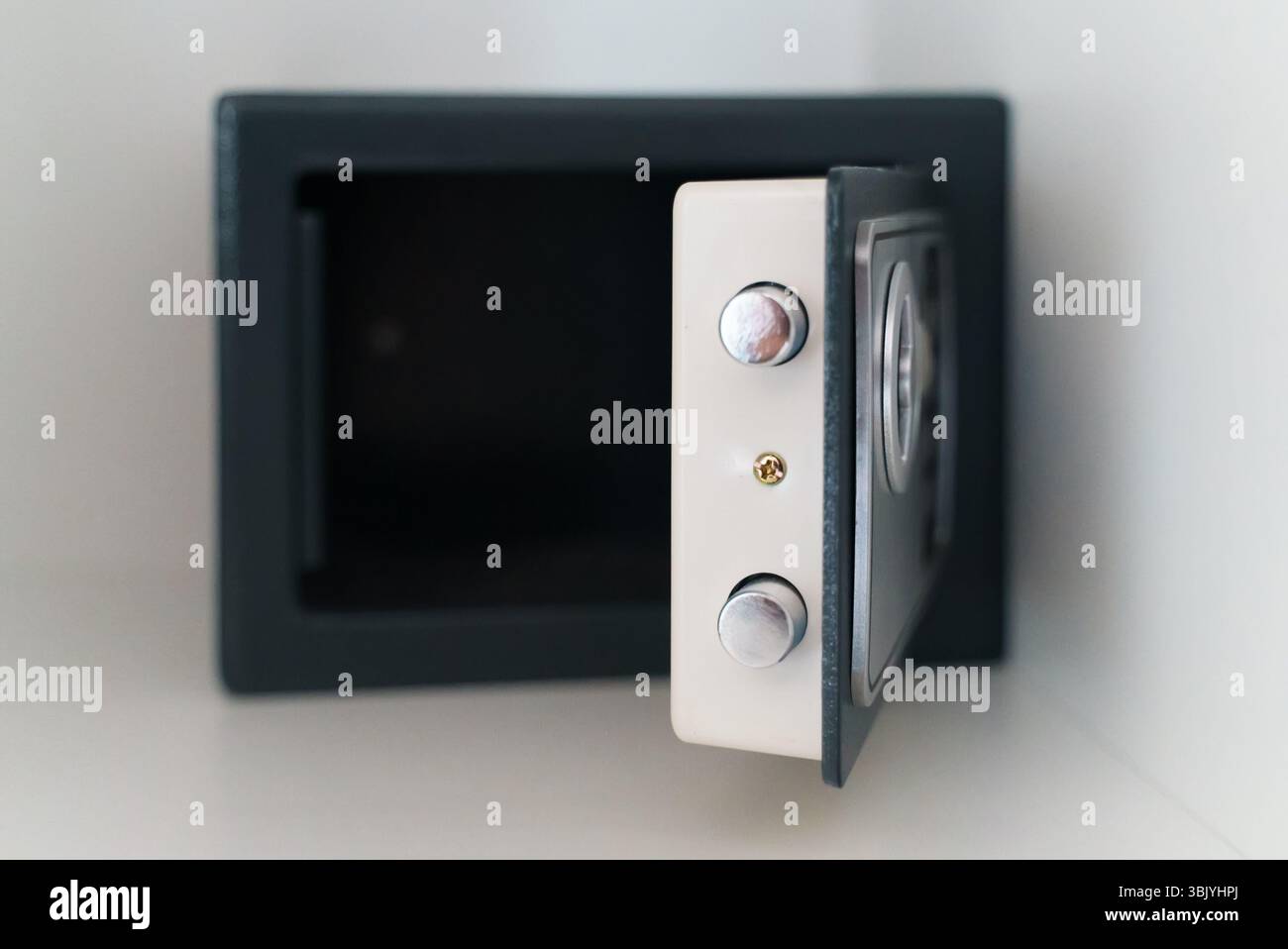 Black small home or hotel safe with keypad. Stock Photo