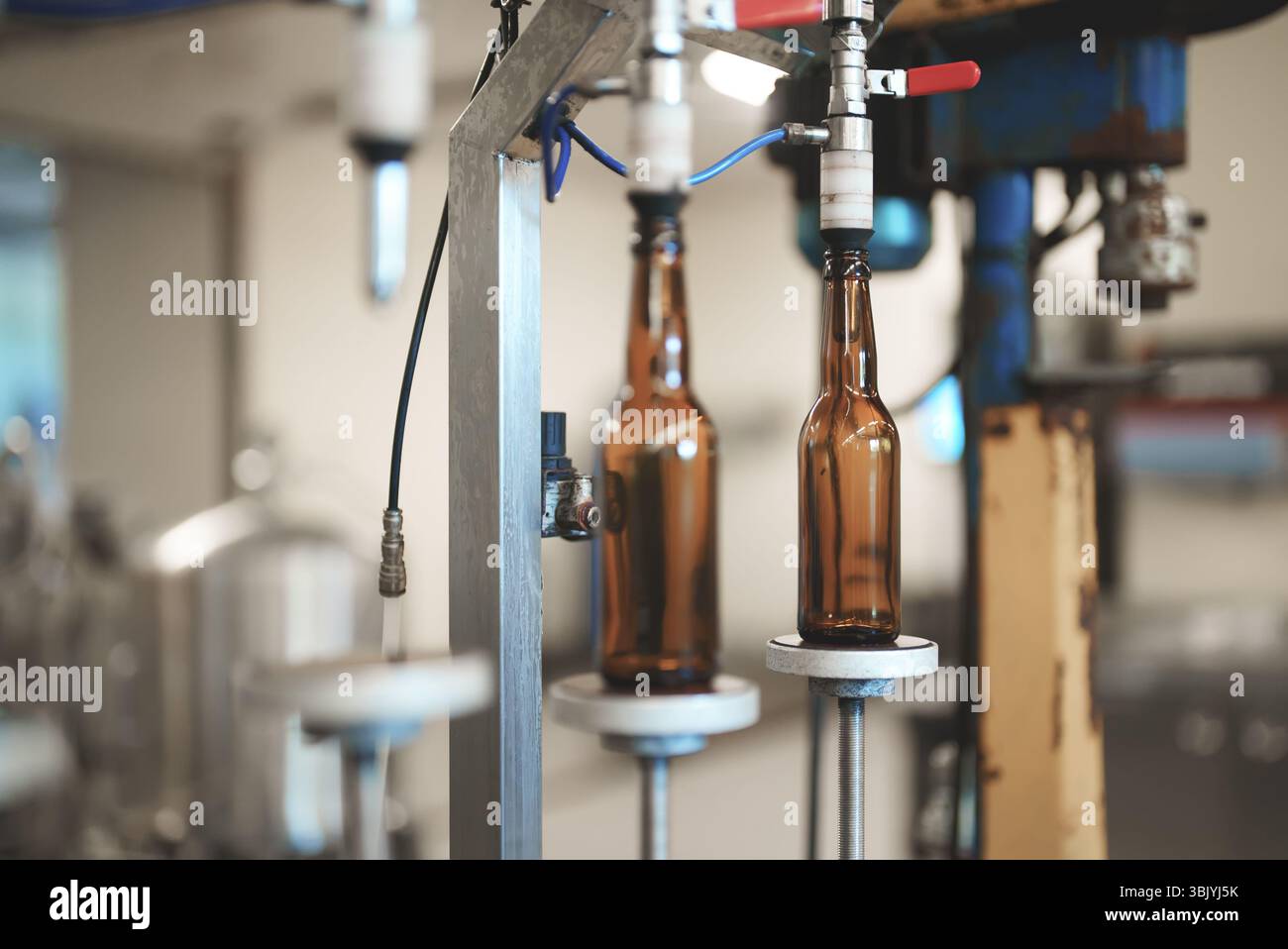 Empty bottles prepared for beer filling. Stock Photo