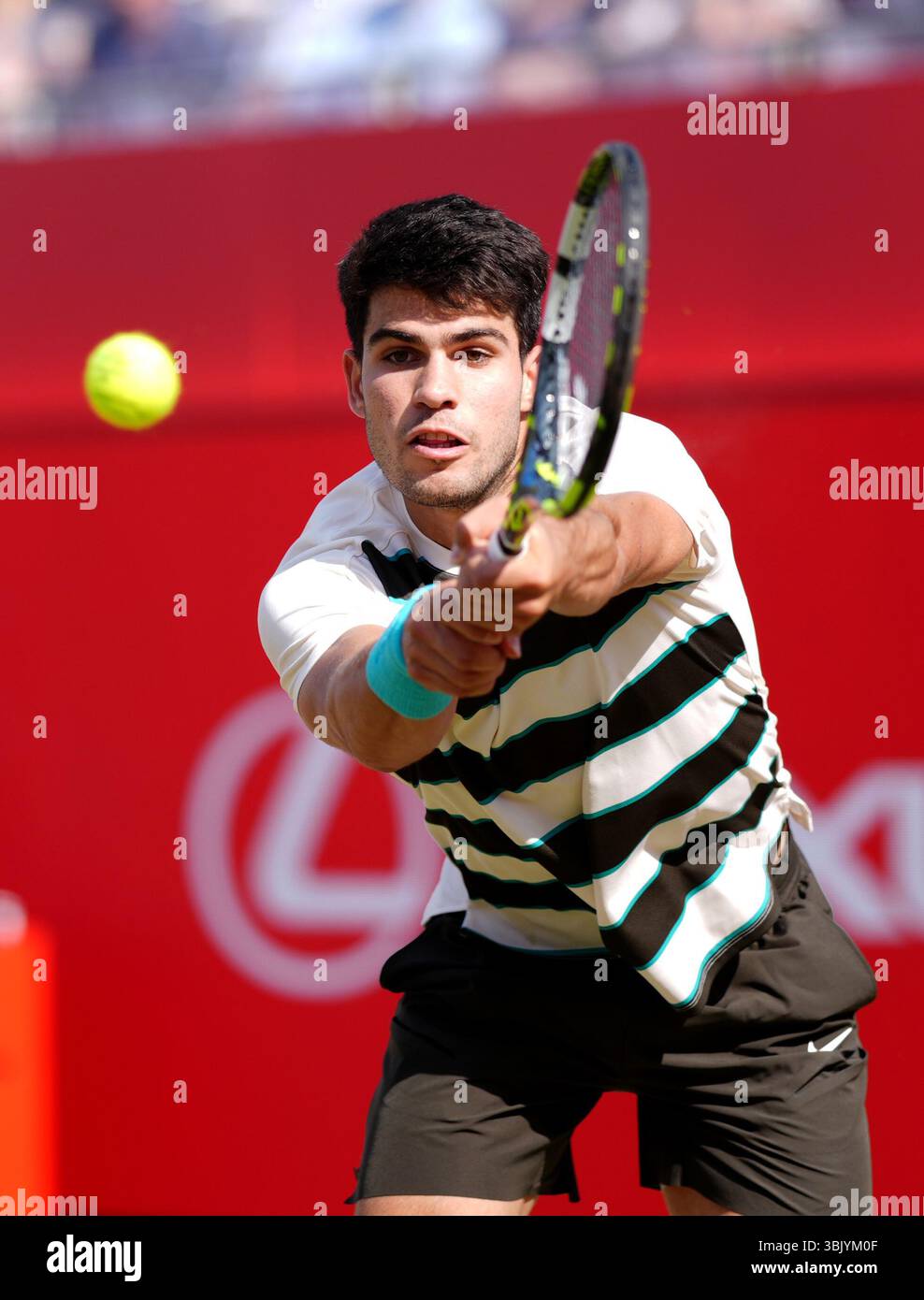 Carlos Alcaraz in action against Adam Walton, on day nine of the HSBC Championships at The Queen's Club, London. Picture date: Tuesday June 17, 2025. Stock Photo