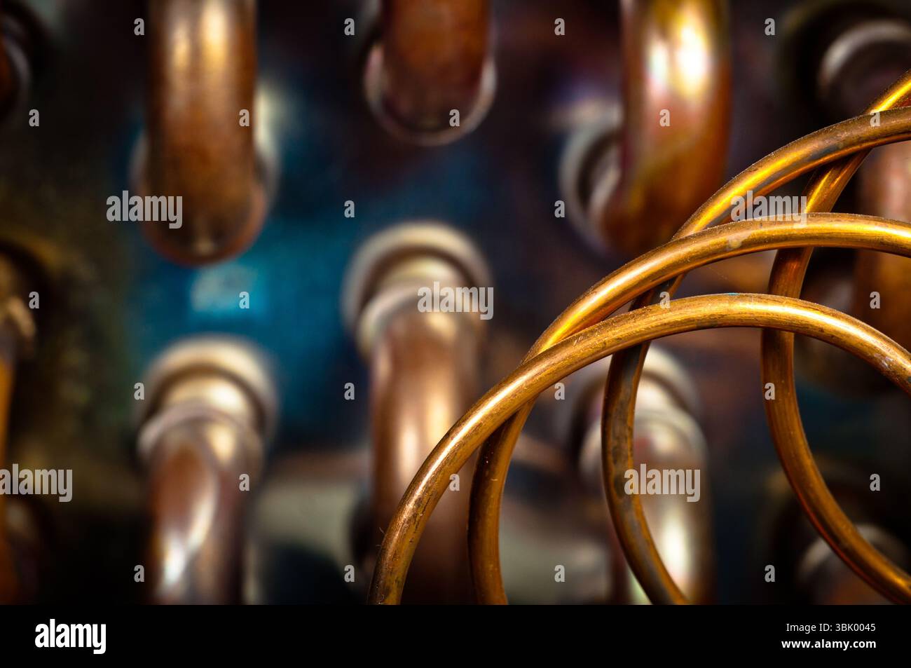Orange pipes and hoses with blurry background Stock Photo